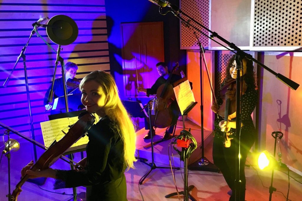 Holly Workman violinist during a string quartet studio recording session with three other musicians