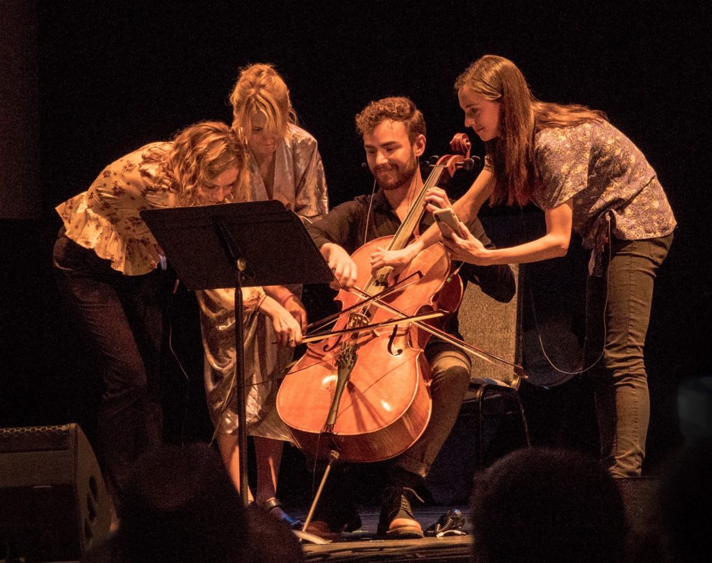 Holly Workman, violinist, playing one cello with three other musicians, Pamela Z Attention,